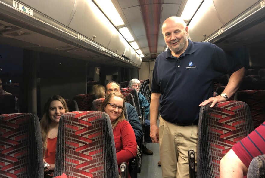 North East ISD teacher Mitzi Moore, center, and Bexar County AFT President Tom Cummins, right, aboard a bus to Austin Mar. 11, 2019.