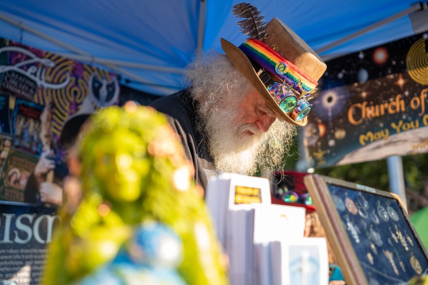 Oberon Zell attends his booth at the festival. He is a naturalist, author, and co-founder of the Church of All Worlds in Missouri, the first the 1960s. 