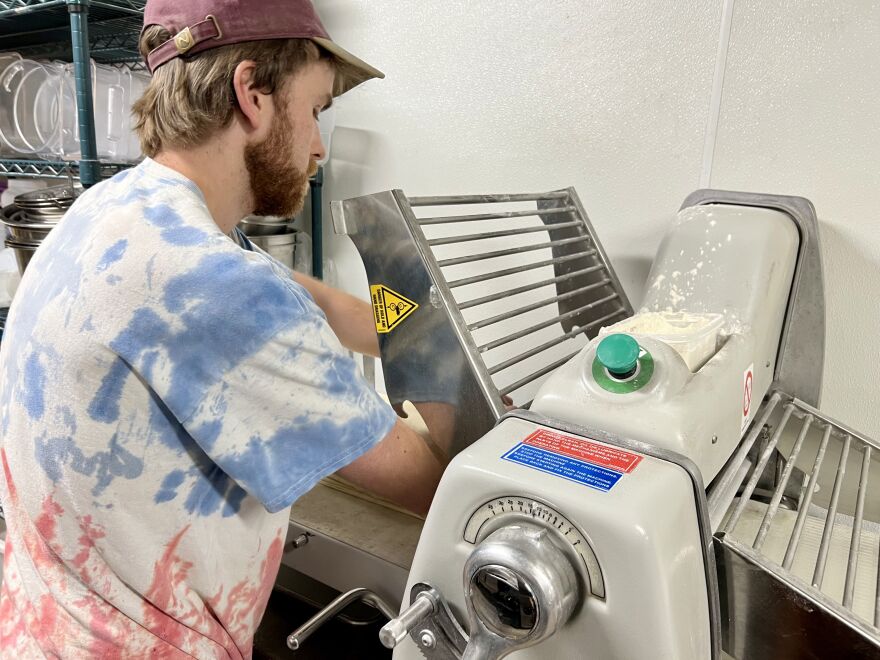 Tim McKenna used a dough roller to stretch out a sheet of butter, as he prepared croissants for the next day.