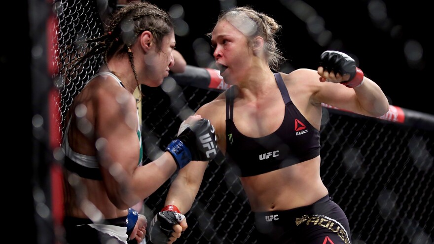 Ronda Rousey (right), mid-fight with Bethe Correia. This bout didn't last much longer after the photo was taken. It didn't last very long, period.