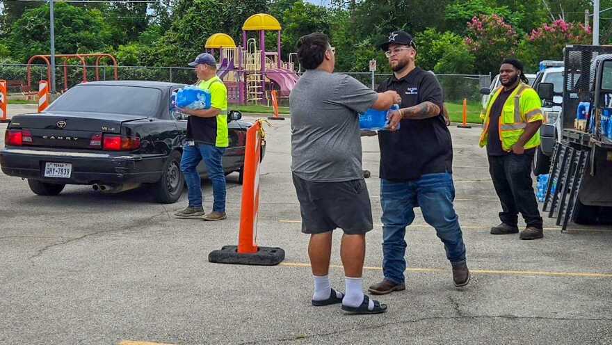A bottled water distribution site is set up at the North Tri-Ethnic Community Center, 2950 Roosevelt Ave. on Monday.