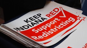 Signs at a pro-redistricting rally at the Indiana Statehouse on Friday, Dec. 5, 2025.