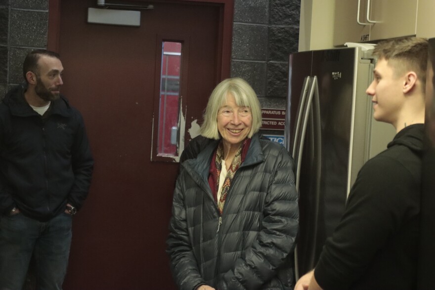 Victoria Lydle speaks with public safety officials who rescued her after she was mauled by a bear in July. Lydle met with over a dozen responders at Fire Station 14 in East Anchorage on Nov. 25.