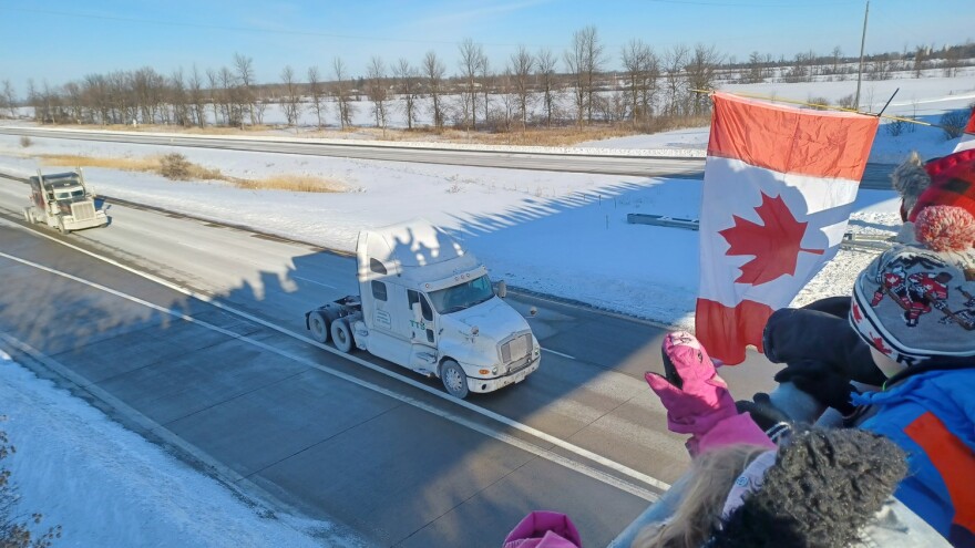 Freedom convoy supporters on an overpass at Highway 417 near Vankleek Hill Ontario on Friday, January 28, 2022.