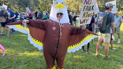 Janet Hoffer, dressed as an eagle, attended the “No Kings" protest at Cora P. Roberson Park in Gainesville on Saturday. October 18, 2025.