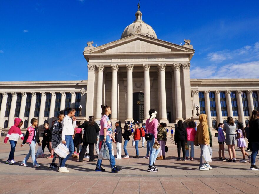 Students walk in a line before entering the Oklahoma State Capitol in Oklahoma City on Feb. 25, 2025. (