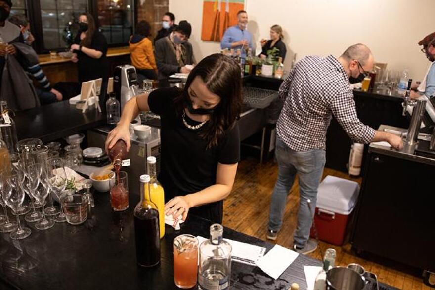 Bartender Ariana D'Angelo creates a zero-proof cocktail on the evening of AltBar's first pop-up event at Fuego Coffee Roasters. AltBar is tapping into the moment sobriety culture is having, with a burst of alcohol-free spirits hitting the market in record numbers.