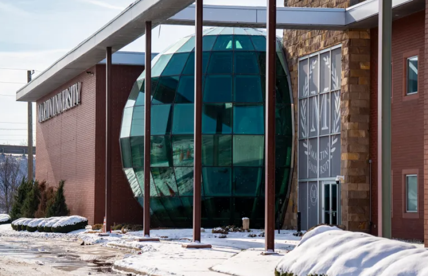 Snow covers the entrance to a Martin University building on Dec. 16, 2025, in Indianapolis. The university will close at the end of the current semester, as announced in a release on Dec. 9, 2025.