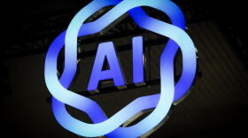 Signage of AI is displayed during the MWC (Mobile World Congress), the world's biggest mobile fair, in Barcelona on March 3, 2025. (Manaure Quintero/AFP via Getty Images)
