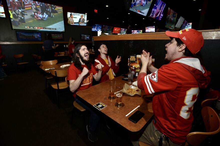 Fans inside Buffalo Wild Wings in Independence celebrate a Chiefs defensive play in the first quarter of the AFC Championship Game on Sunday, Jan. 30, 2022.