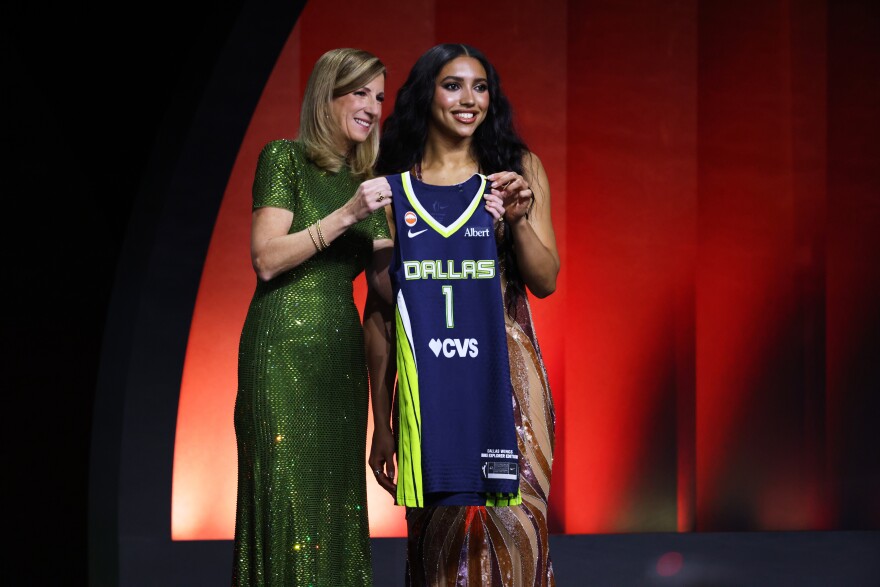 UConn guard Azzi Fudd poses with WNBA commissioner Cathy Engelbert after being selected first overall by the Dallas Wings in the first round of the WNBA basketball draft Monday, April 13, 2026, in New York.