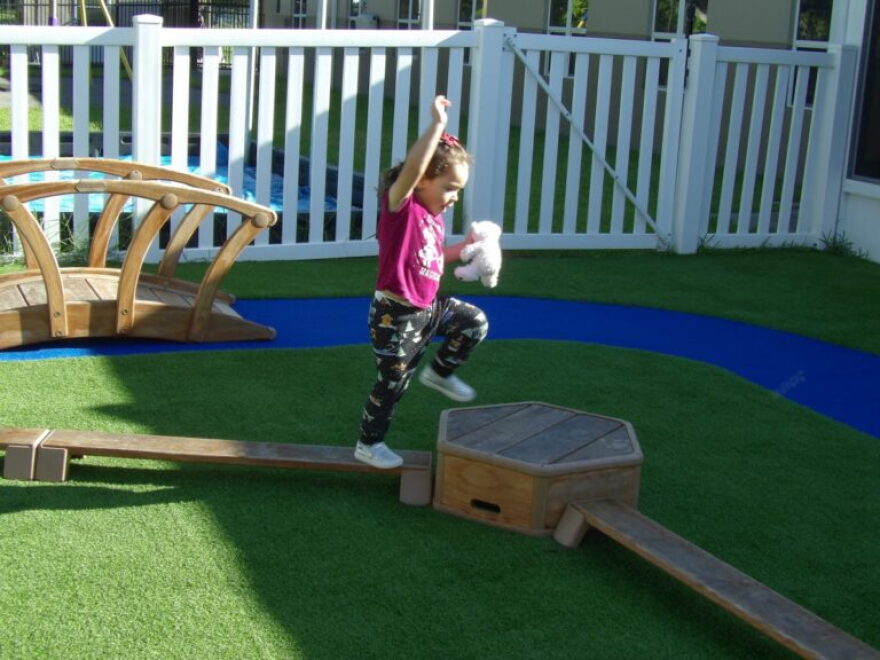 A child plays on outdoor playground equipment at Children First in Sarasota on Sept. 9, 2026.