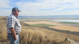 Scott Seus, president of the Klamath Water Users Association, looks over the Tule Lake National Wildlife Refuge from Sheepy Ridge on Aug. 20, 2026. Seus supports a proposal to circulate water through agricultural lands and refuge wetlands before returning it to the Klamath River.