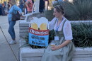 In the finest Bavarian beer hall tradition, a friendly fraulein welcomed Oktoberfest attendees.