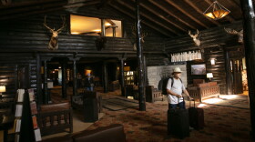 Tourists check out of the El Tovar Hotel as lodging along the rim of the canyon was shut down due to flooding, Monday, Aug. 31, 2026, at Grand Canyon National Park, Ariz.