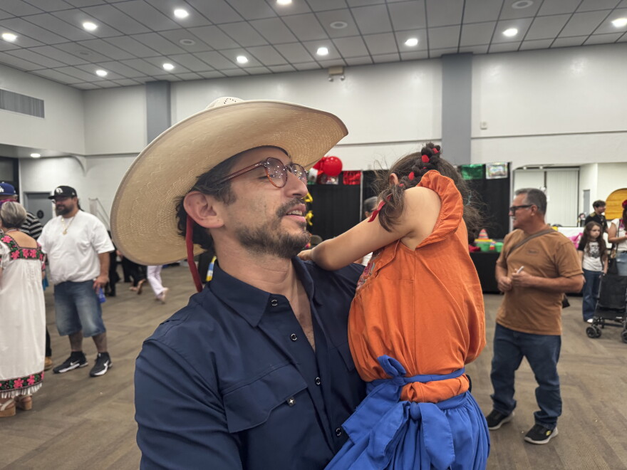 Doctor and Yuma resident, Diego Marquez, hugs his daughter Ivanna.