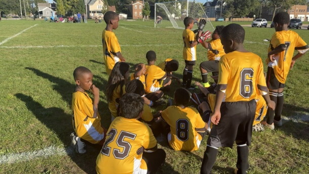 Constance Lane Elementary School's Fourth Grade soccer team huddles up on the side of the field during their game