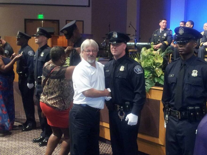 New Detroit police officers receiving their badges