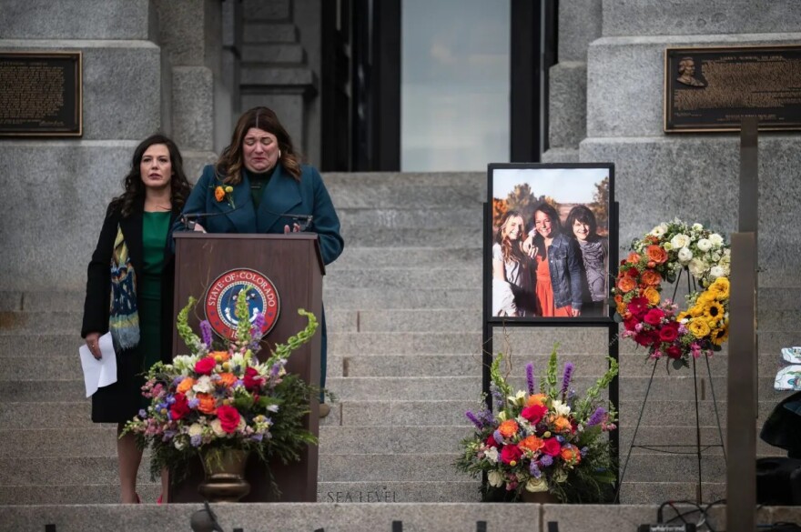 Hazel Gibson, left, and state Rep. Jenny Willford deliver remarks during the celebration of life for state Sen. Faith Winter on the west steps of the Colorado Capitol on Friday, Dec. 5, 2025.