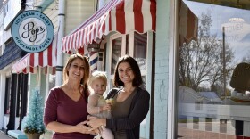 JoAnn Romano, her granddaughter, and daughter in front of Nana's Tiny Town in Spring Hill.