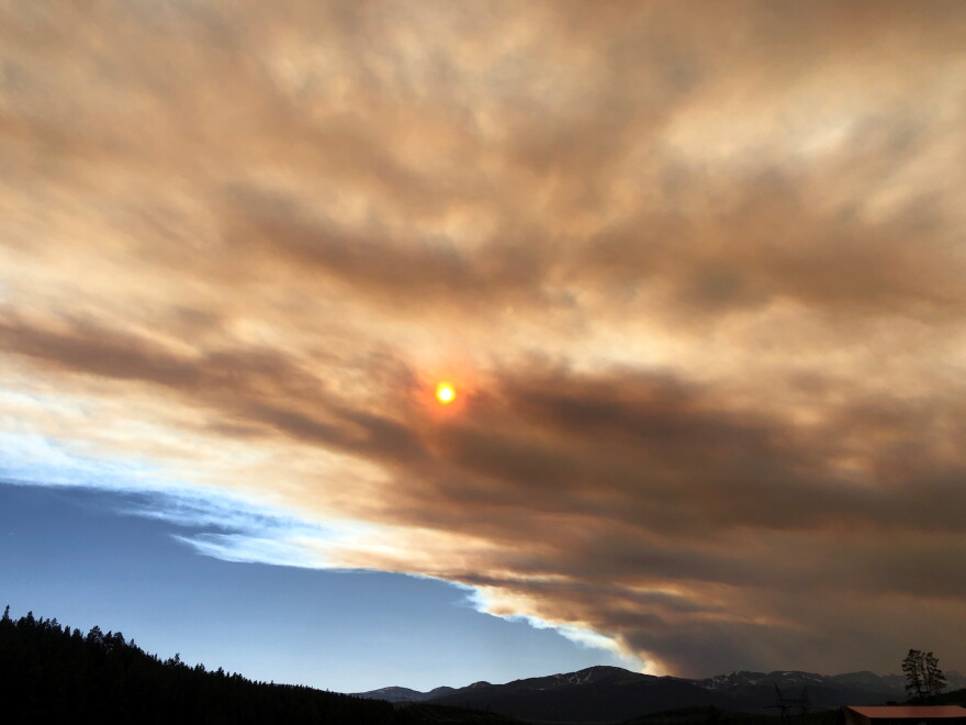  Wildfire smoke above Leadville makes the sun appear a dark shade of red in 2021. 