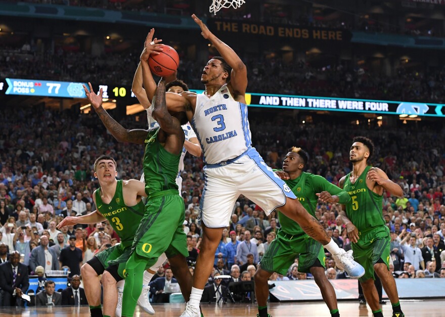 North Carolina's Kennedy Meeks (3) of the and Jordan Bell (1) of the Oregon get tangled up during the Final Four Semifinal.