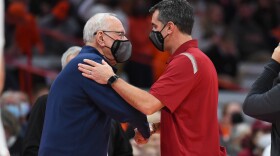 Syracuse head coach Jim Boeheim (left) shakes hands with Colgate head coach Matt Langel (right) following the Orange's first loss to the Raiders in nearly 60 years. The last Colgate win over Syracuse took place in 1962, 14 years before Boeheim took over SU's program.