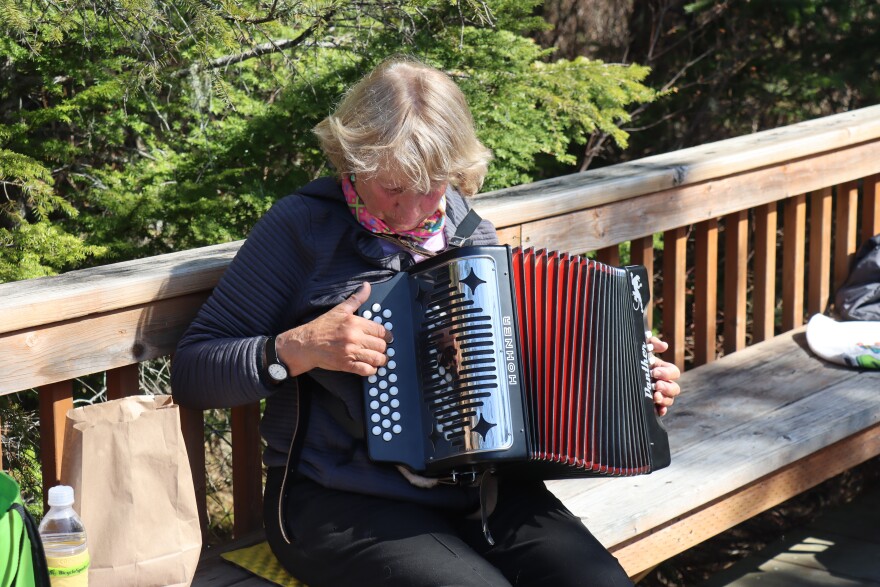 Nene Wolfe plays her button accordion on the Chilkoot Indian Association trails in Haines in late April, 2026.