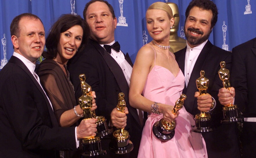 Producers and cast celebrate after winning best picture for <em>Shakespeare in Love</em> during the 71st Annual Academy Awards.