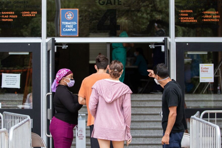 UT Austin students wait in line to be tested for COVID-19 at DKR Stadium before the Sept. 12 football game against UT-El Paso.