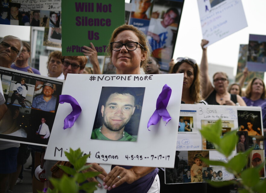 Christine Gagnon of Southington, Conn., protests with other family and friends who have lost loved ones to OxyContin and opioid overdoses at Purdue Pharma LLP headquarters in Stamford last year.