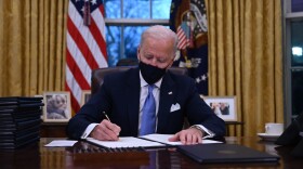 President Joe Biden sits in the Oval Office as he signs a series of orders at the White House in Washington, DC, after being sworn in at the US Capitol on Jan. 20, 2021. (Jim Watson/AFP via Getty Images)
