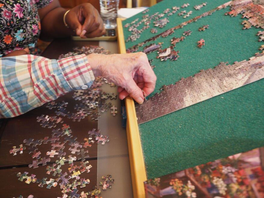 R. and A.J. do puzzles 