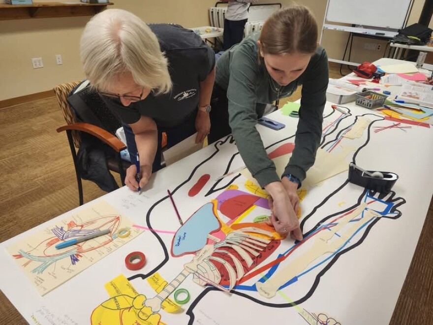 Lake City resident Lori Stewart, left, and Rowan McNeese, right, in the classroom at the Lake City Medical Center.