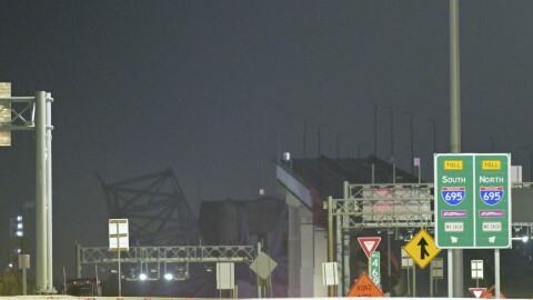 Parts of the Francis Scott Key Bridge remain after a container ship collided with a support Tuesday, March 26, 2024, in Baltimore. The major bridge in Baltimore snapped and collapsed after a container ship rammed into it early Tuesday, and several vehicles fell into the river below. Rescuers were searching for multiple people in the water. (AP Photo/Steve Ruark)