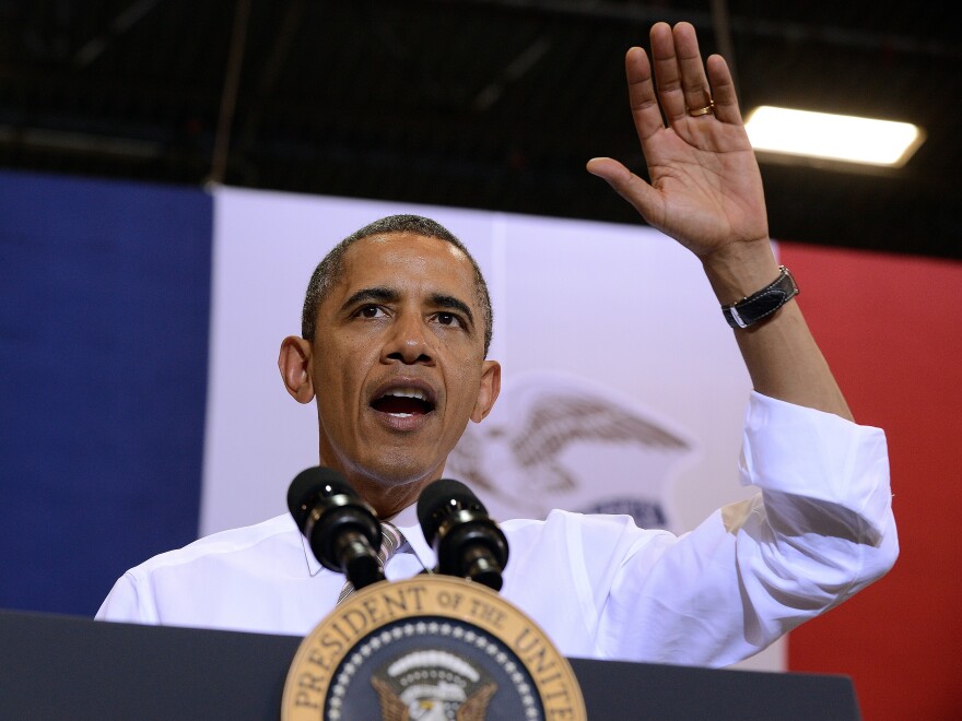 President Barack Obama waves after speaking at the TPI Composites, a wind blade manufacturer, in Newton, Iowa, on May 24, 2012.