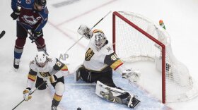 Colorado Avalanche's Gabriel Landeskog (92) and Vegas Golden Knights' Zach Whitecloud (2) look for the rebound on the save from goalie Robin Lehner (90) during the second period of an NHL Stanley Cup hockey qualifying round game in Edmonton, Alberta, Saturday, Aug. 8, 2020.