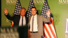 HHS Secretary Robert F. Kennedy Jr. (left) stands with Republican gubernatorial candidate Zach Lahn at a rally in Clive organized by MAHA PAC, the political arm of the Make America Healthy Again movement, on October 17, 2026.