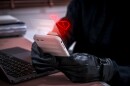 Romance scam concept showing a cybercriminal using a smartphone to deceive victims with fake love messages. Online dating fraud and social engineering risk through chat applications and social media.