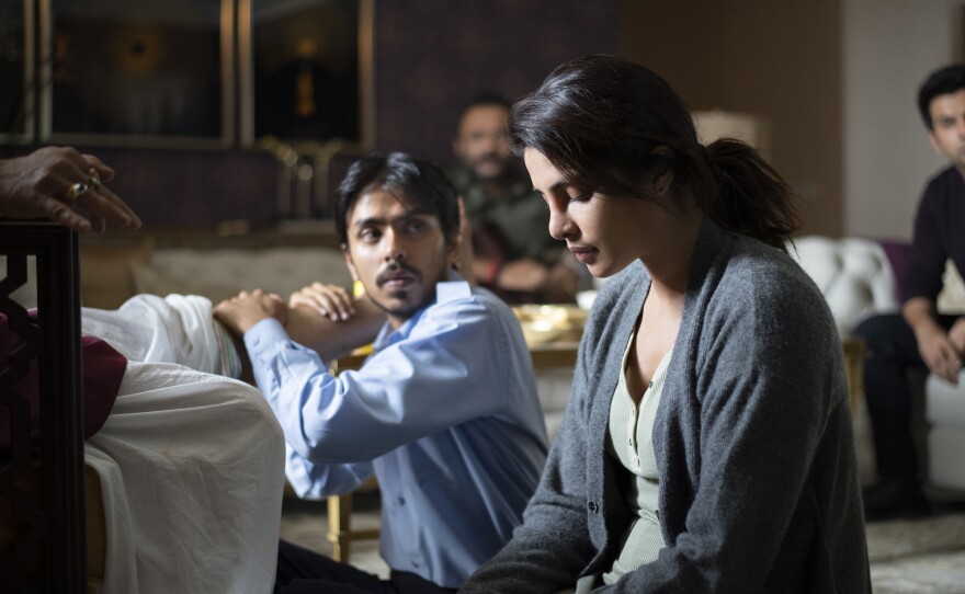 As the driver for a rich couple, Balram is tasked with massaging the tired legs of his boss Ashok (Rajkummar Rao) while his wife Pinky (Priyanka Chopra Jonas) looks on. Jonas, was one of the producers for the film, which chronicles Balram's attempt to rise out of poverty.