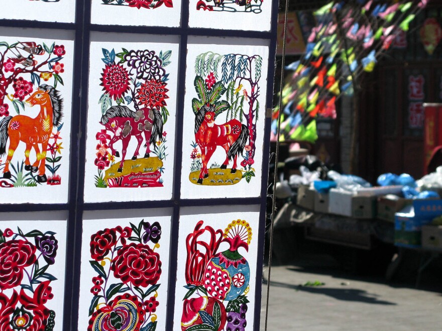 Intricate, hand-cut paper decorations are a popular handicraft in Nuanquan Town, especially during the New Year.