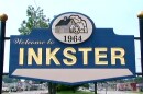 A blue sign reads "Welcome to INKSTER" in gold type.