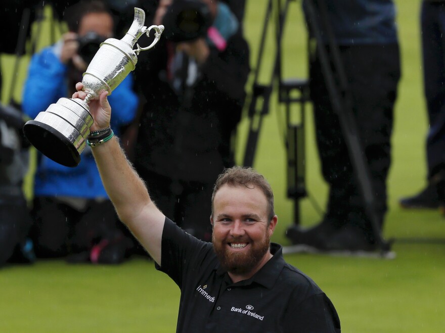 Shane Lowry of Ireland celebrates with the Claret Jug during the final round of the British Open held at Royal Portrush Golf Club, just a few hours from where he grew up.