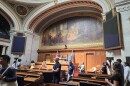 Tourists of the Wisconsin Legislature walk through the Assembly chamber where state laws are passed.