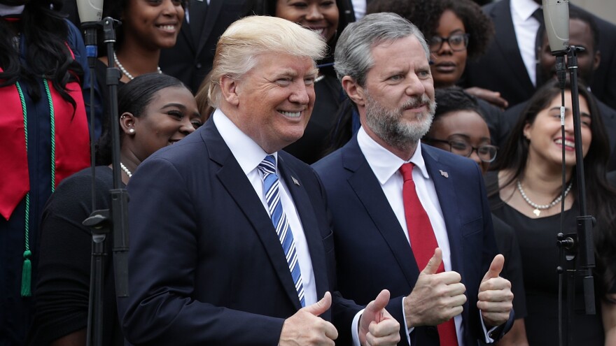 President Trump poses with Liberty University President Jerry Falwell Jr., during commencement at Liberty University May 13 in Lynchburg, Va.