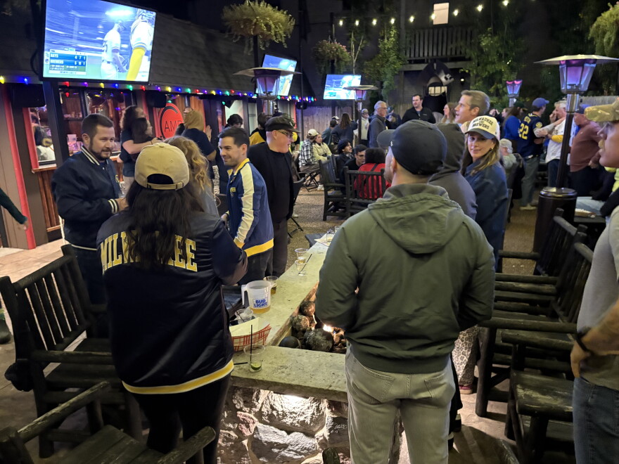 Brewer camaraderie abounded at Shorewood bar as team took game two.