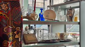Shelves inside Grove Galleria feature vintage trinkets alongside secondhand kitchen items.