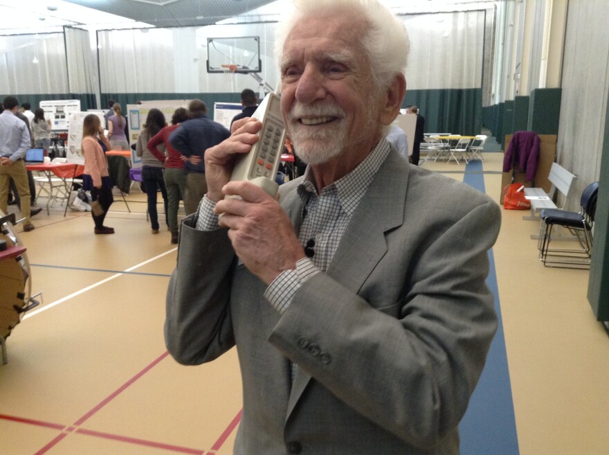 Martin Cooper with his 1973 invention