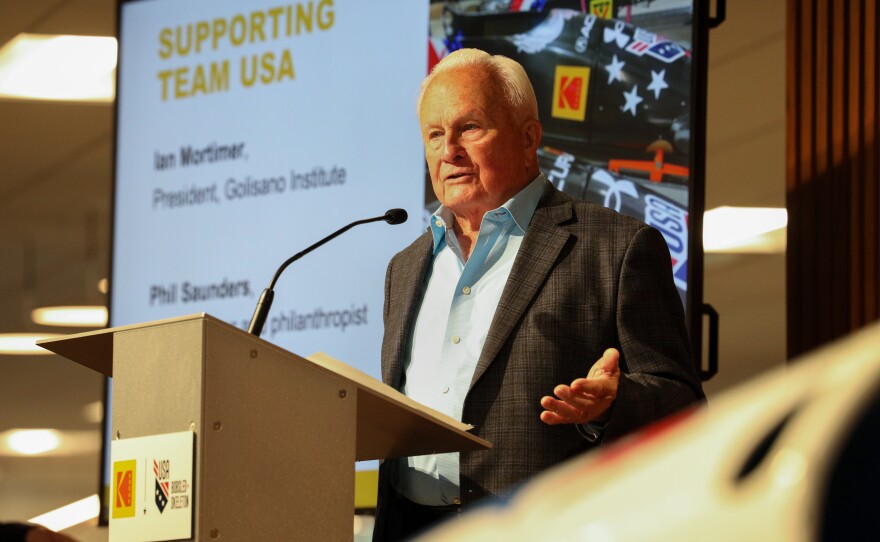 Phil Saunders, chairman of Saunders Management, and Eastman Kodak Company announced its support of USA Bobsled/Skeleton ahead of the 2026 Winter Olympics, unveiling a new state-of-the-art bobsled in Kodak’s iconic yellow and red at the Golisano Institute for Business & Entrepreneurship. The historic 1956 bronze medal–winning “Tyler Sled,” designed and raced by Kodak engineers, was also on display.