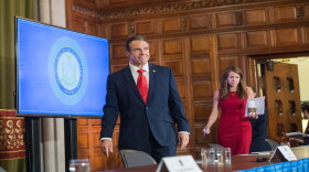 Gov. Andrew Cuomo enters the daily coronavirus briefing Friday at the State Capitol in Albany.